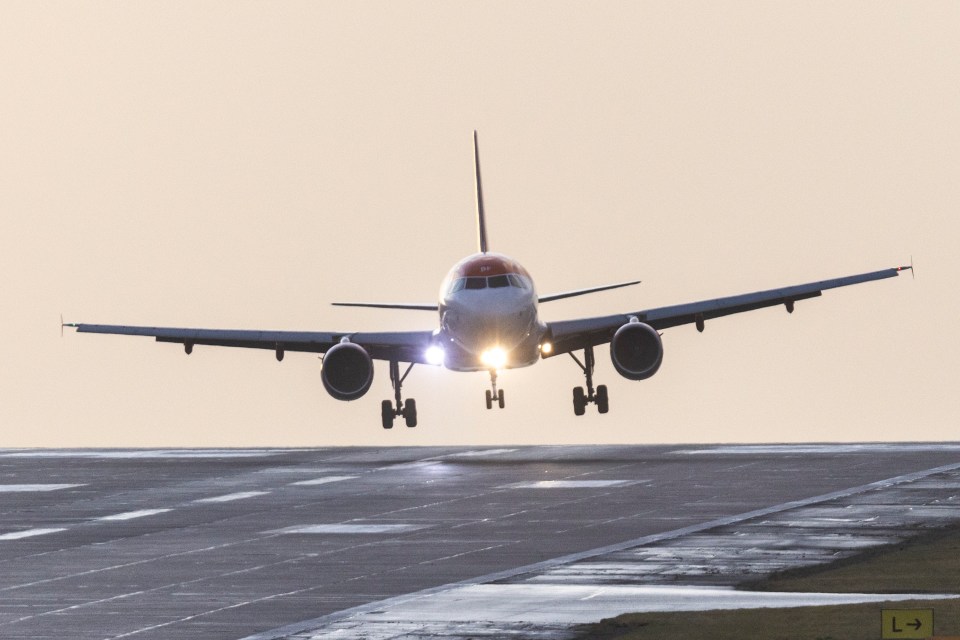 A Easyjet aircraft arriving from Belfast struggles to land this morning in strong winds at Leeds Bradford airport