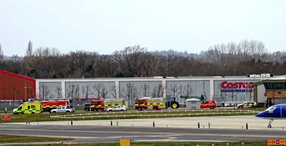 Fire crews raced to Farnborough Airport, Hants after the star’s plane twice aborted landing on a day winds hit 80mph