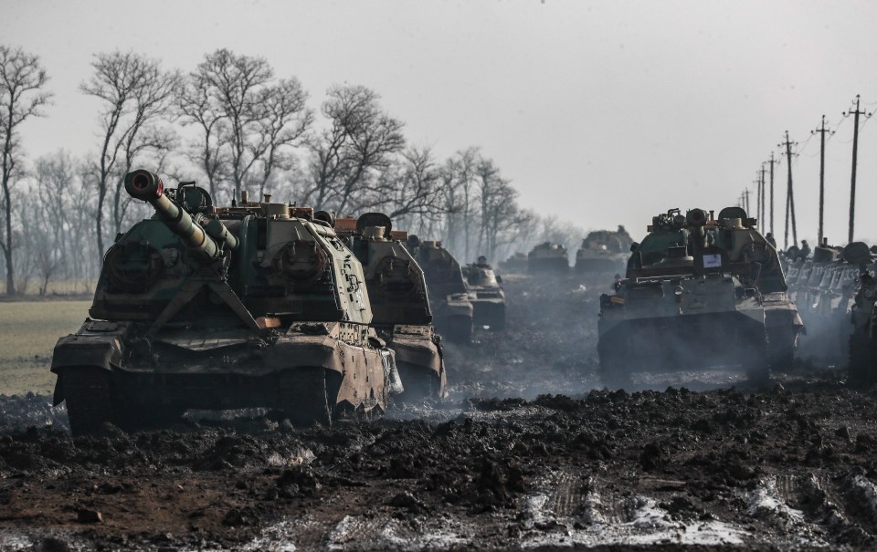 Russian armoured vehicles stand on the road in Rostov region, Russia