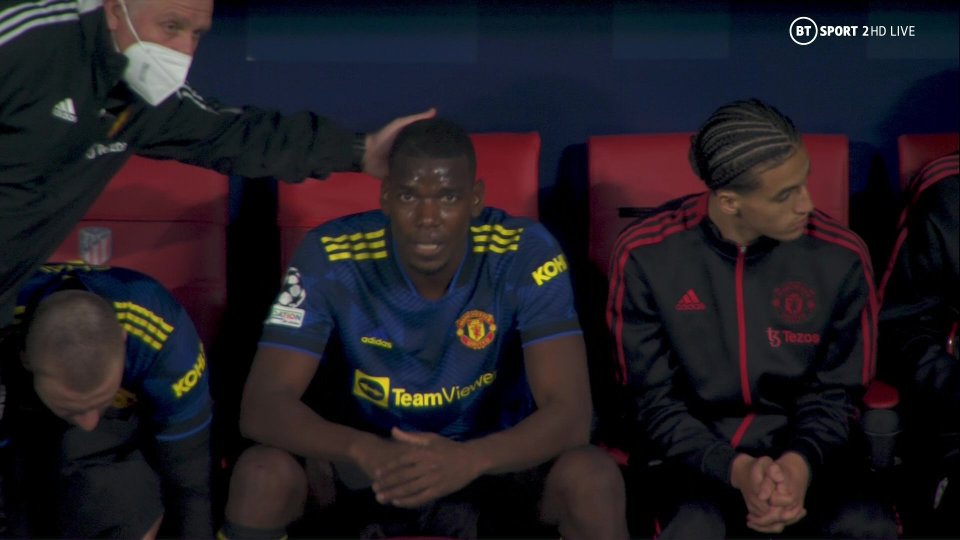 Paul Pogba is patted on the back after being subbed by Man Utd at Atletico