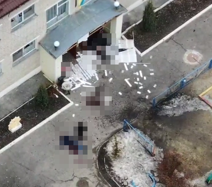 Horror photos showed at least two bodies lying outside the building in Okhtyrka