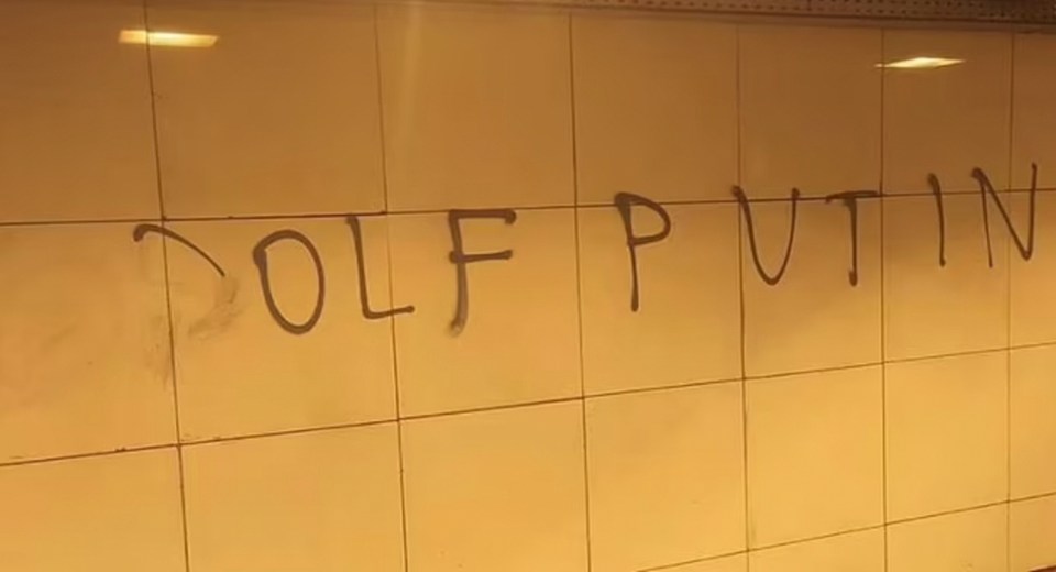 Graffiti comparing Putin to Hitler scrawled in a Saint Petersburg metro station