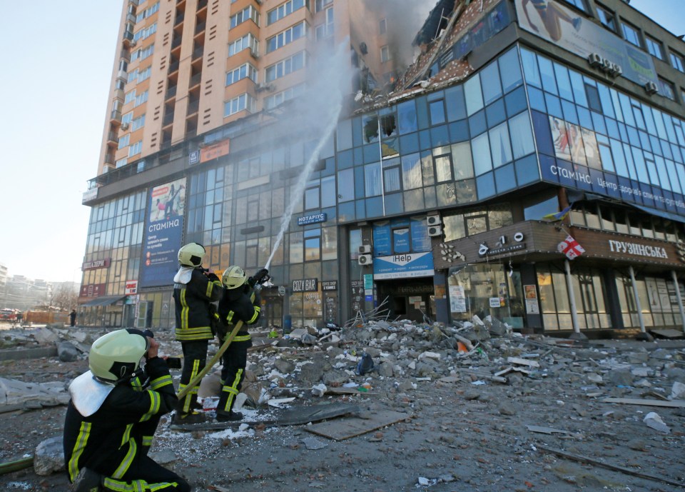 Firefighters tackling a blaze in a tower block that was hit by a missile