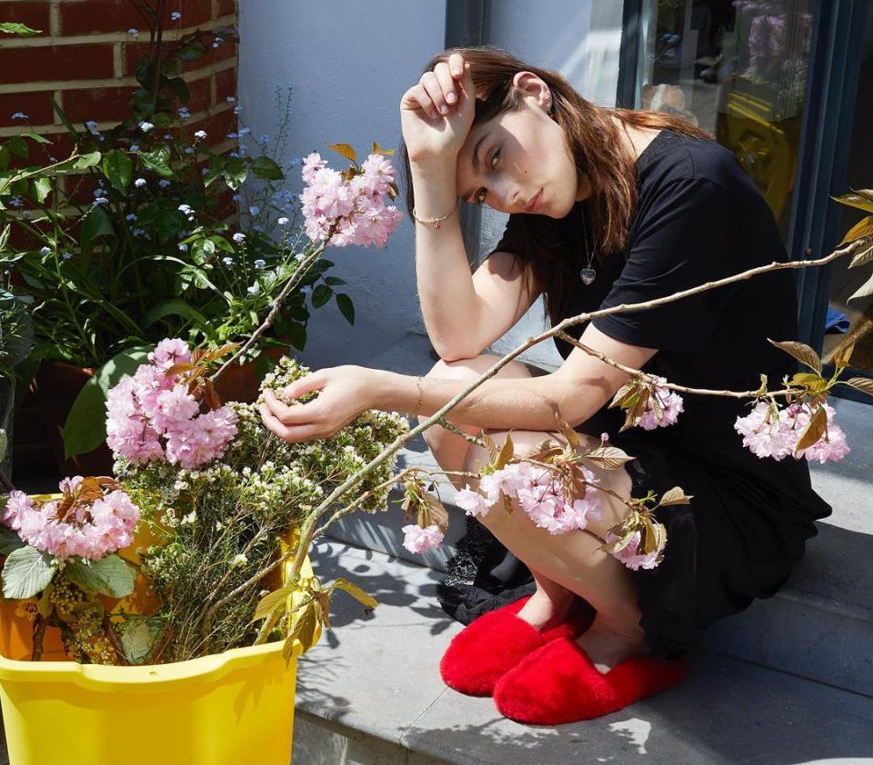 Amber is a keen fan of nature as she poses on her back step with her plants