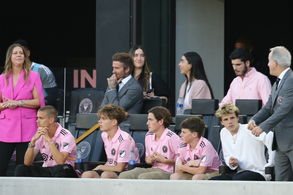 David, Romeo (front left) and Cruz (front right) Beckham watched the MLS clash with Chicago Fire