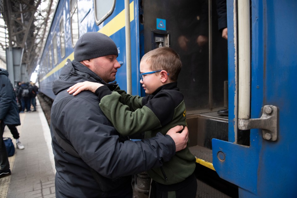 Dad Ruslan says goodbye to his son Georgi at Lviv station