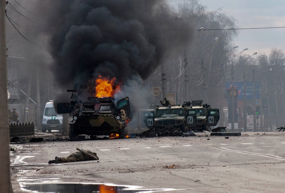 An military truck burns after being abandoned following fighting in Kharkiv, Ukraine