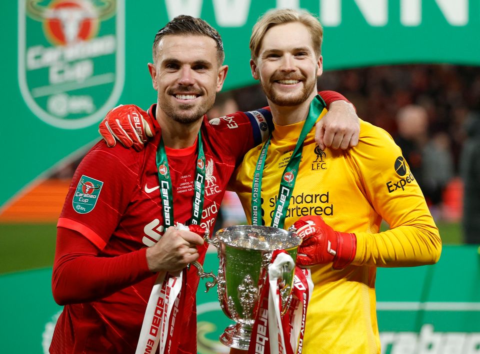 Kelleher and captain Henderson celebrate with the trophy