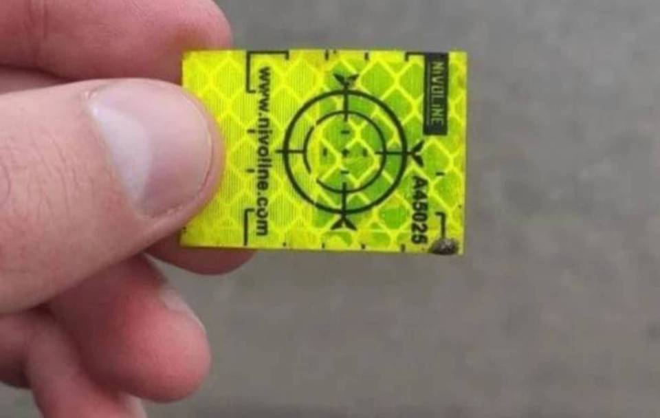 Small reflective tags such as this have also been found all over Kyiv