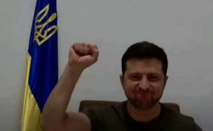 Zelenskyy raises as he received a round of applause at the European Parliament