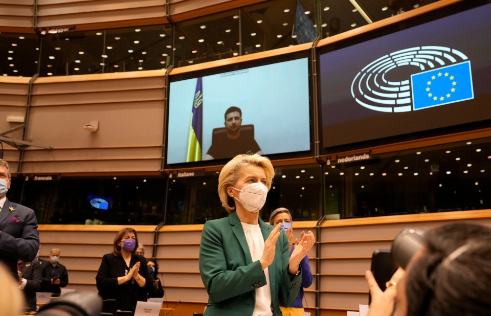 European Commission President Ursula von der Leyen applauds after an address by Zelenskyy