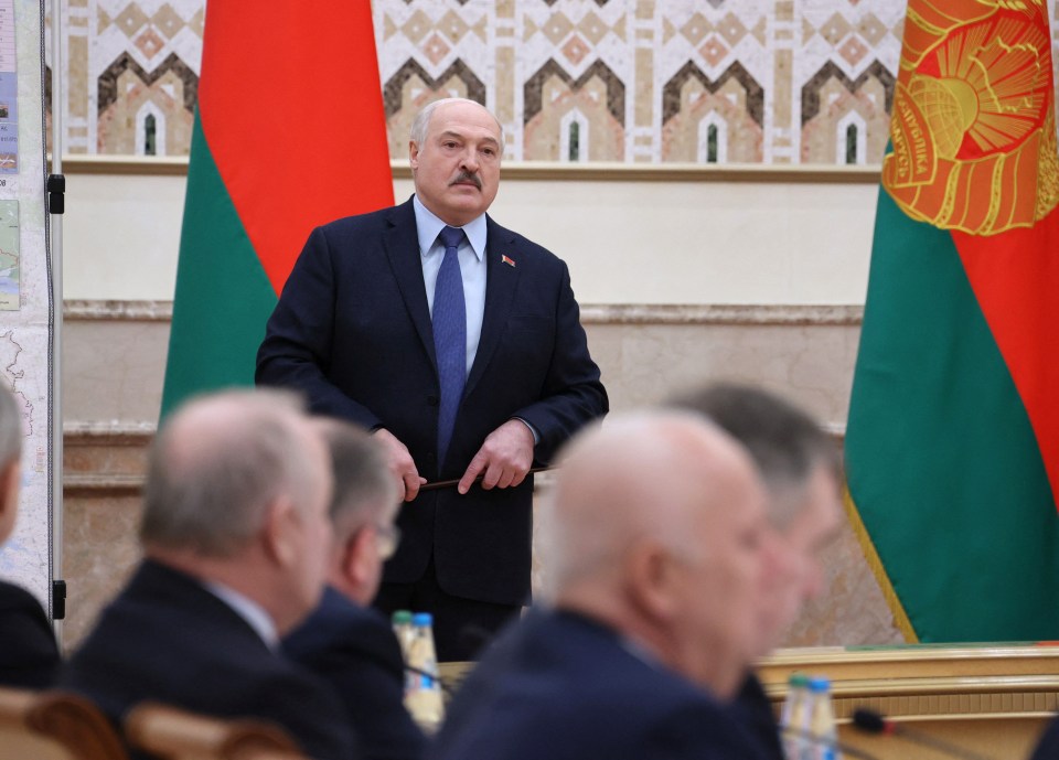 President Alexander Lukashenko earlier insisted he had no plans to join Putin's war - pictured at a meeting today in Minsk