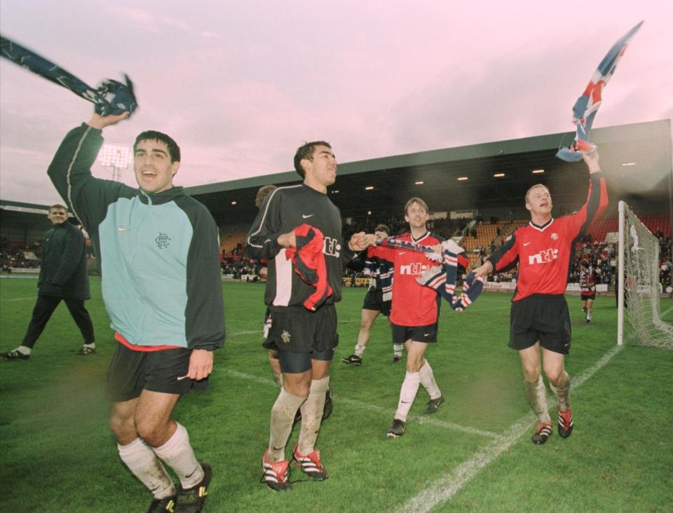 Reyna's dad Claudio (left) alongside Van Bronckhorst (right) at Rangers