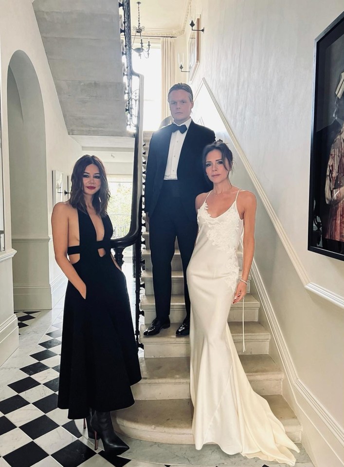 Victoria Beckham wore a white silk gown to the showbiz wedding of the year