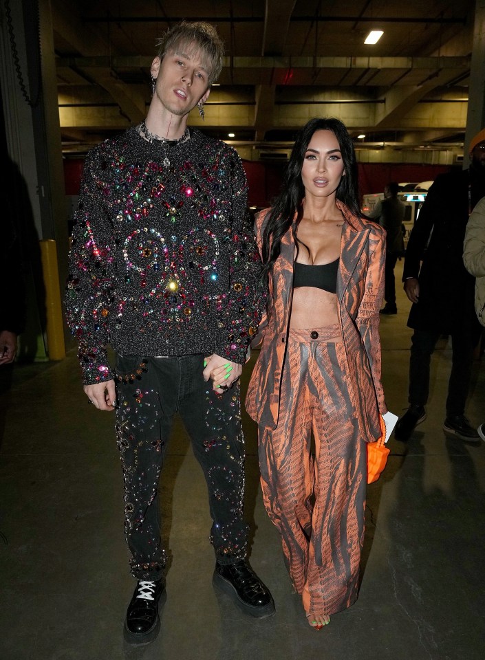 Machine Gun Kelly scored a slam dunk by arriving at a basketball game with his sexily dressed girlfriend Megan Fox