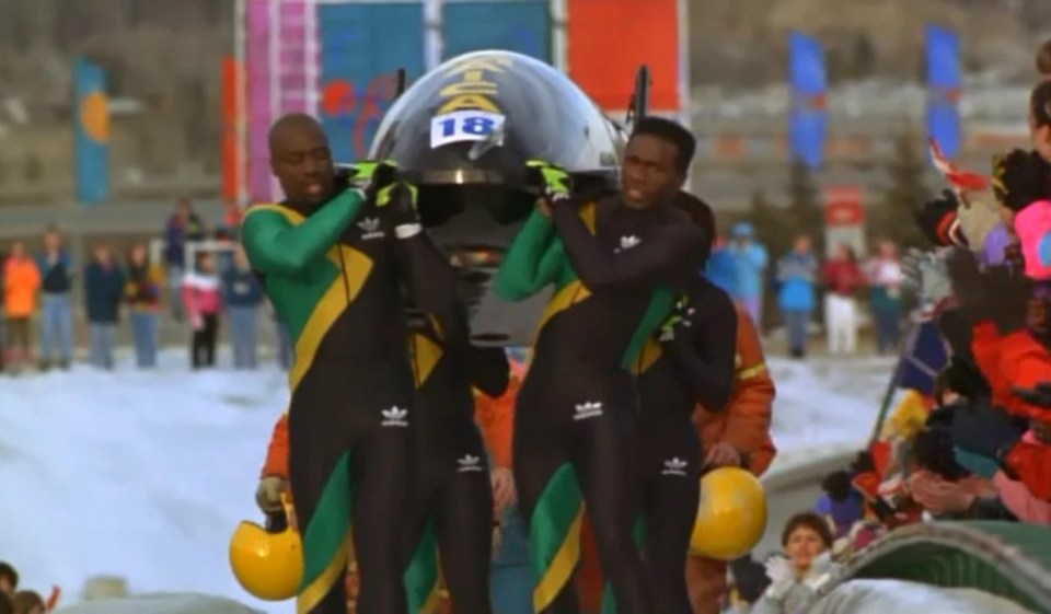 The bobsled heroes walked as the 600kg sled was pushed to the finish line rather than carried as in Cool Runnings