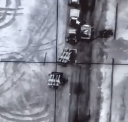 Russian military vehicles are seen in the targeting sights of a drone