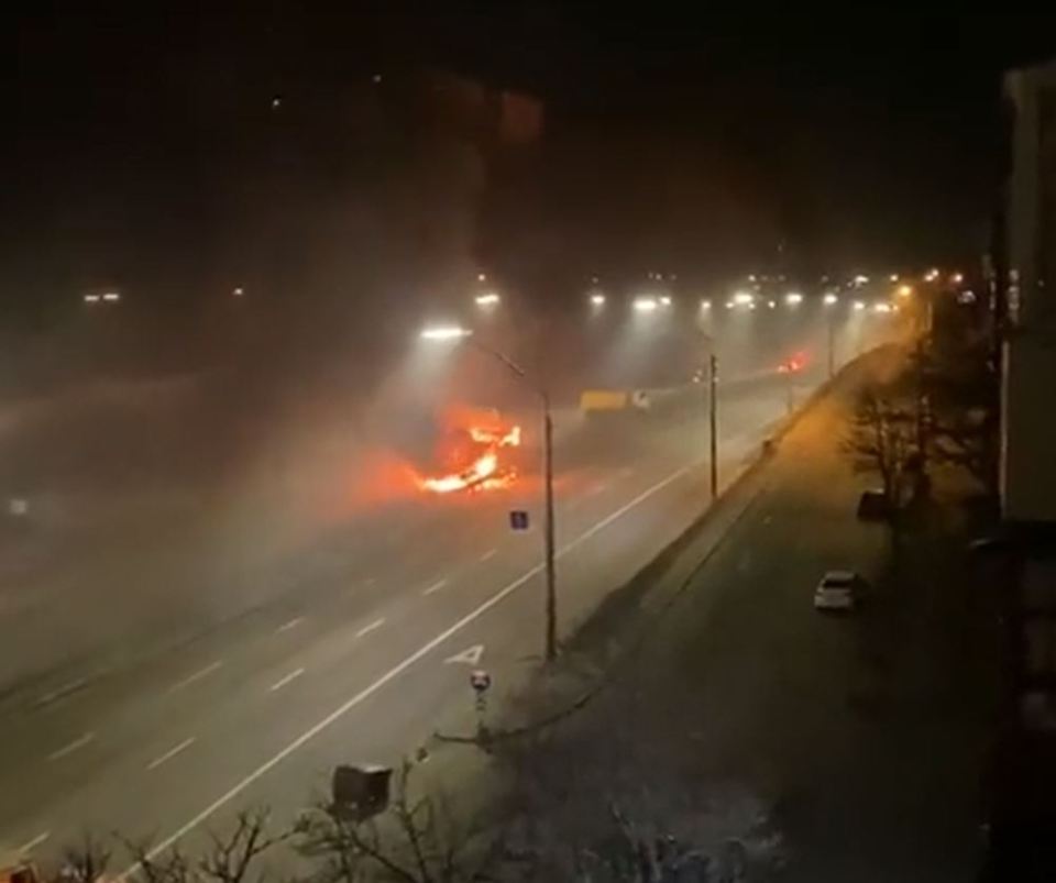 Video appears to show a blazing vehicle hit in shelling in Kyiv