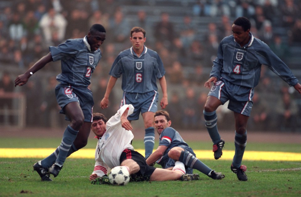 Shota Arveladze against England for Georgia as Gareth Southgate (6) watches on