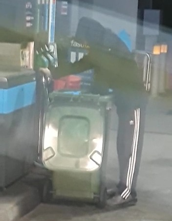 A man was filmed putting £143 worth of fuel into a wheelie bin at a petrol station