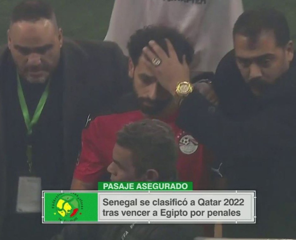 Salah was protected from the invading Senegal fans after Egypt's crushing defeat