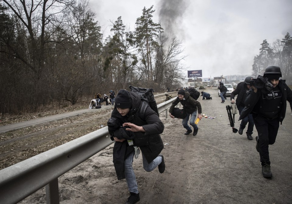 Refugees and journalists run for their lives amid the shelling by the Russians