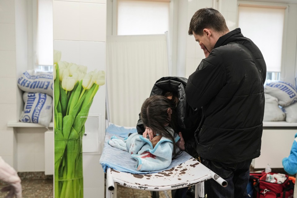 Parents Fedor and Marina Yatsko weeping over their baby son Kirill’s dead body in a Mariupol hospital