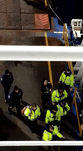 Private security can be seen escorting crew