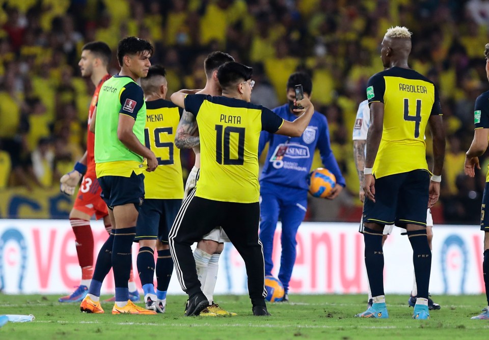 Security rushed on to the pitch to stop the Ecuador fan