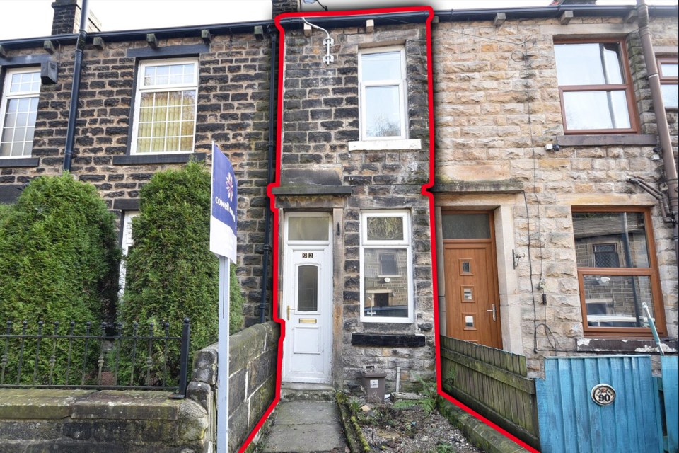 This two-bedroom home is so slim that some passers-by may not notice that it's its own property