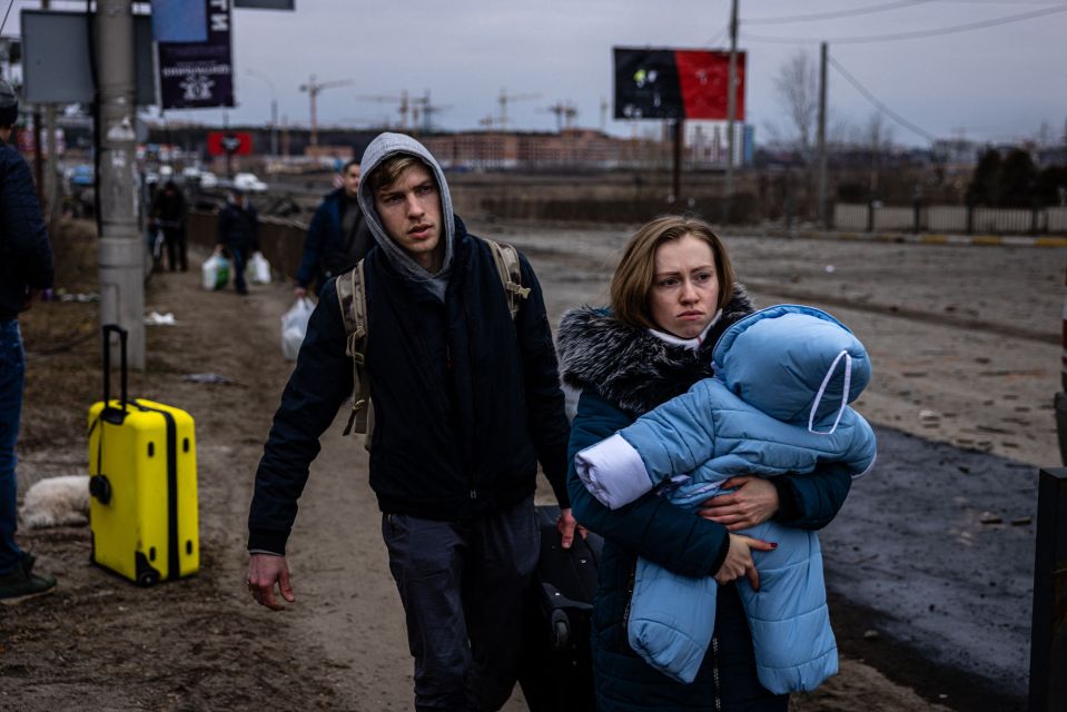 Civilians on the march from the devastation caused by the Russians