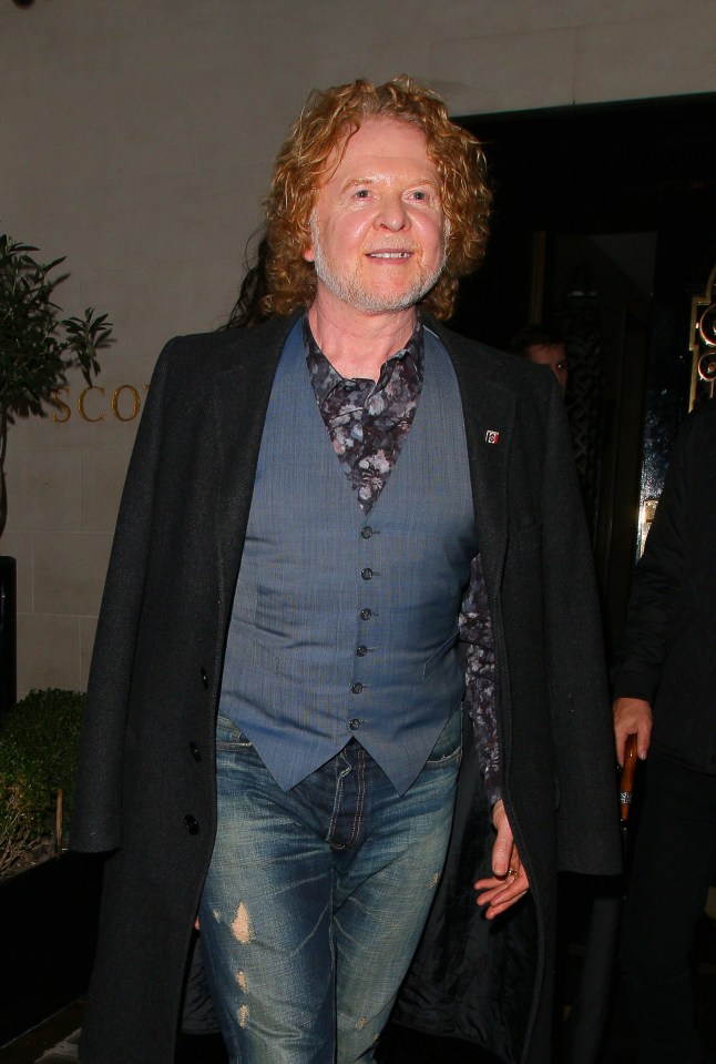 Mick Hucknall told fans last night that he and five members of the six-strong Simply Red band all tested positive for Covid