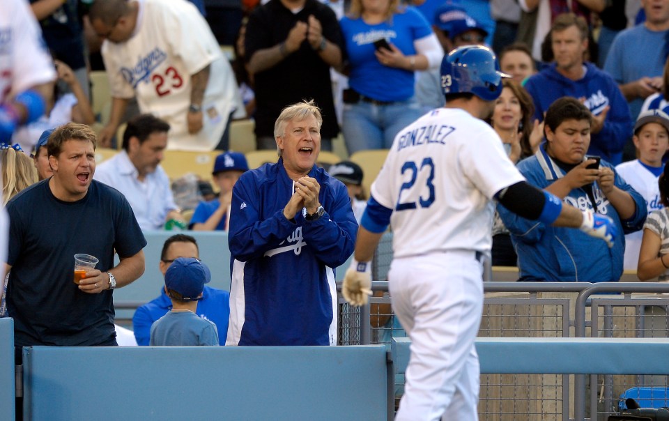 Boehly, left, cheers on the LA Dodgers