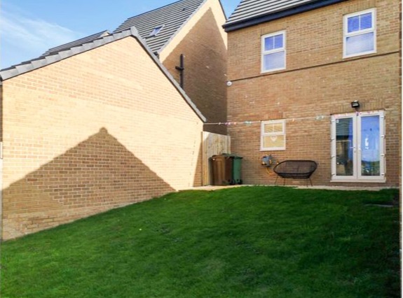 French doors in the kitchen open out onto a large garden