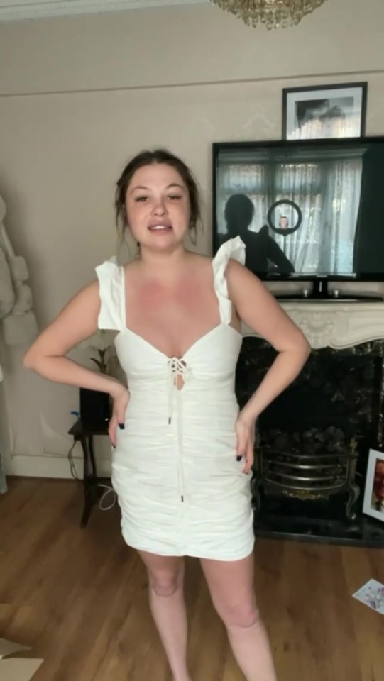 So she posed in the dress she wore when they criticised her to show off her transformation