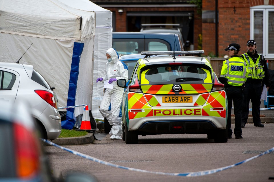 Police and forensics officers at the scene in Walton Cardiff near Tewkesbury