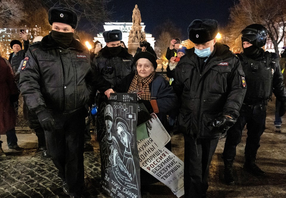 Placard-holding Yelena Osipova, believed to be in her 80s, was forced into the back of a van as fellow demonstrators chanted anti-war slogans