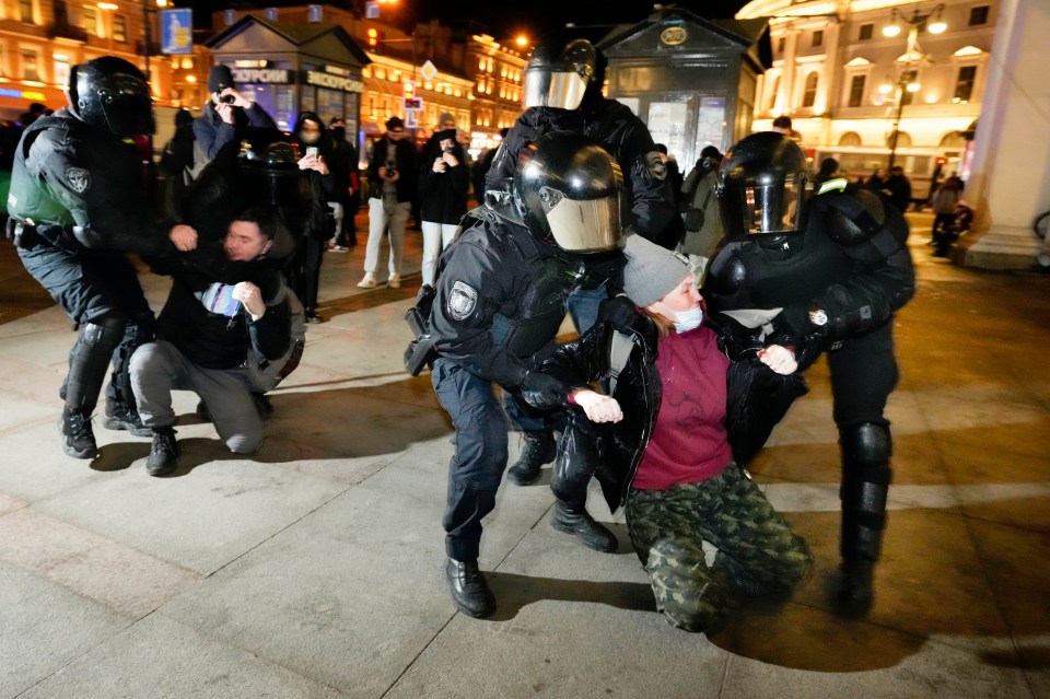 Protesters being carried away by police