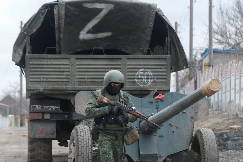 Russian separatists gather in the separatist-controlled settlement of Mykolaivka