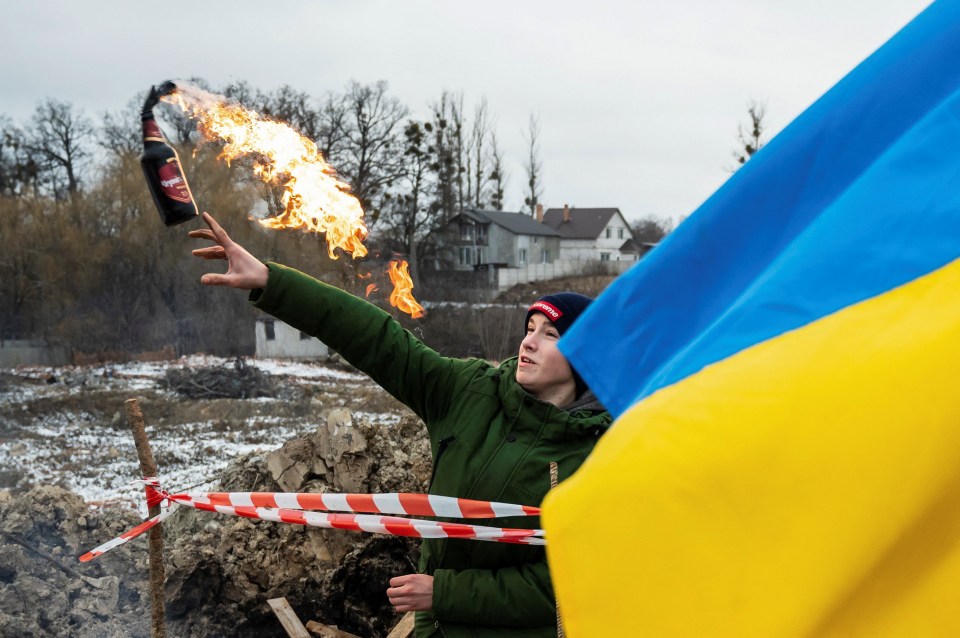 Molotov cocktails being hurled by Ukrainian volunteers