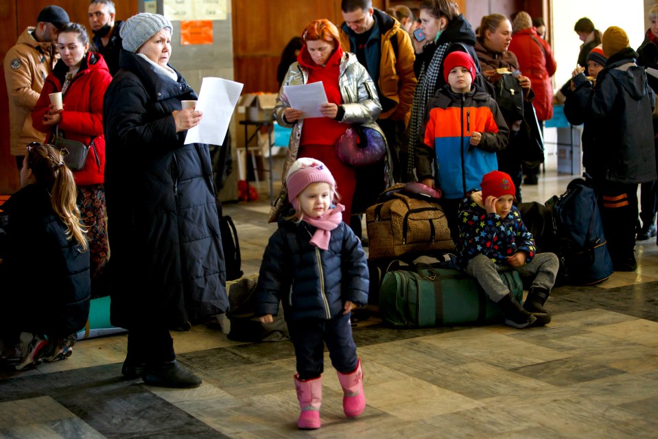 Ukrainian refugees wait for an evacuation train to the Czech Republic in Chop, Zakarpattia Region, western Ukraine