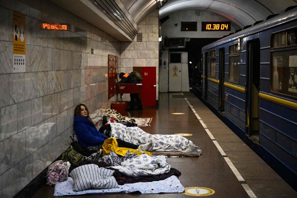 Ukrainians take shelter in a Kyiv underground station as Russian shelling resumes