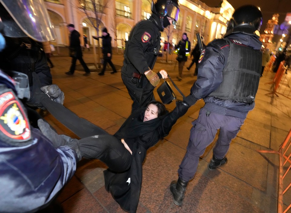 Police also carried away a young woman