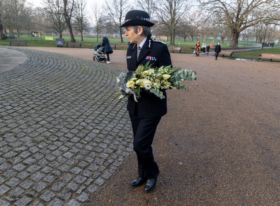 Cressida Dick Commissioner of the Met Police lays flowers in Clapham a year on from the murder of Sarah Everard