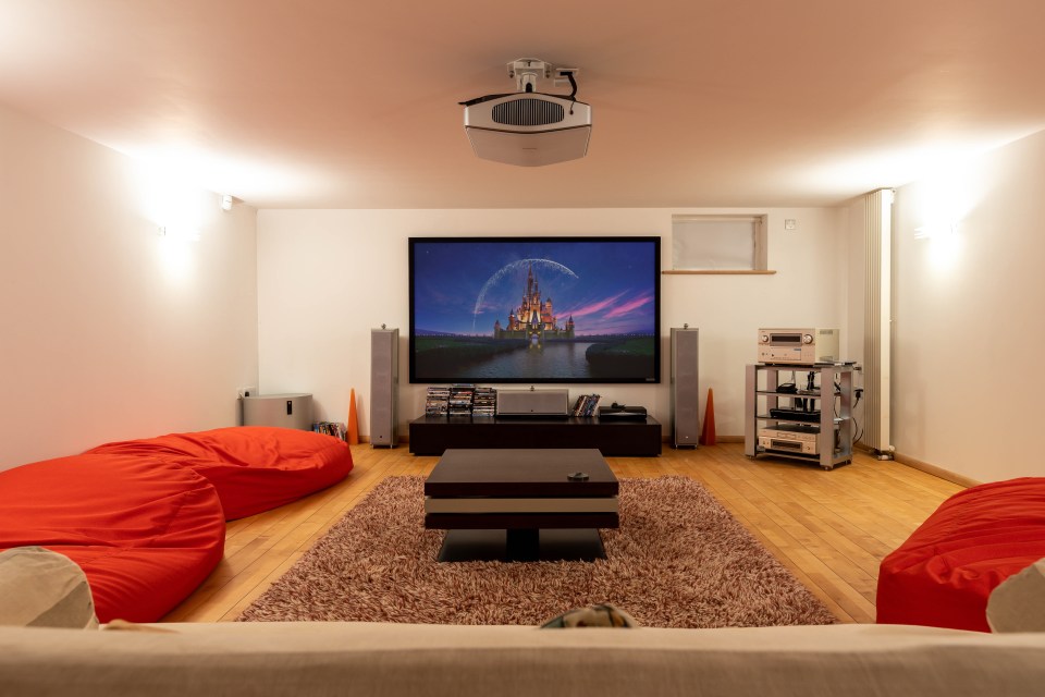 The new owner can enjoy their own cinema room with projector screen