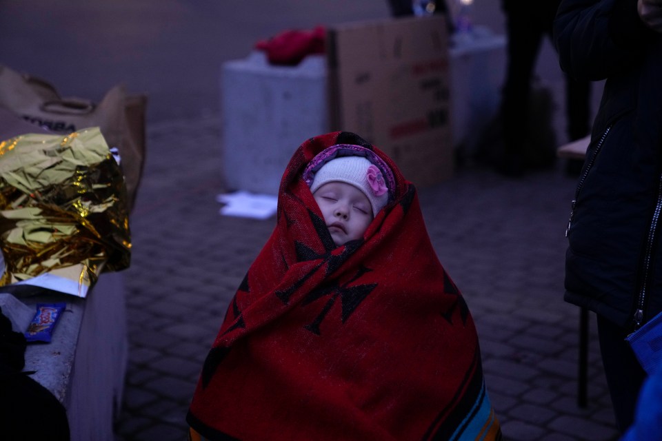 Three-year-old Anna sleeps after fleeing from Ukraine