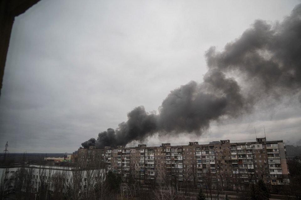 Smoke rises after shelling by Russian forces in Mariupol on Friday