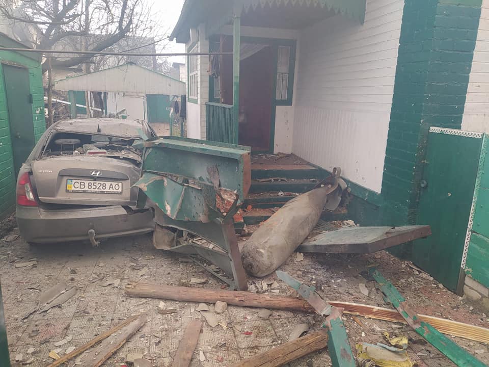 A photo released by the State Emergency Service shows an unexploded aviation bomb outside a home in Chernihiv