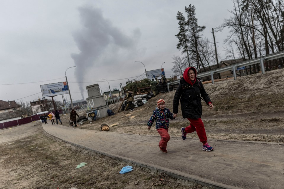 Smoke rises as a mum and daughter flee for their lives