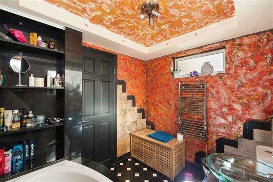 The former-owner's flamboyance stretches to the bathroom